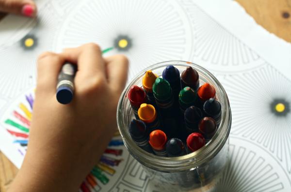 child hand with crayons